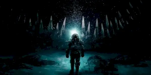 Norah Price standing in front of Cthulhu.