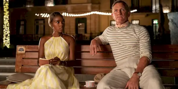 Janelle Monae and Daniel Craig Sitting on a Bench in Glass Onion