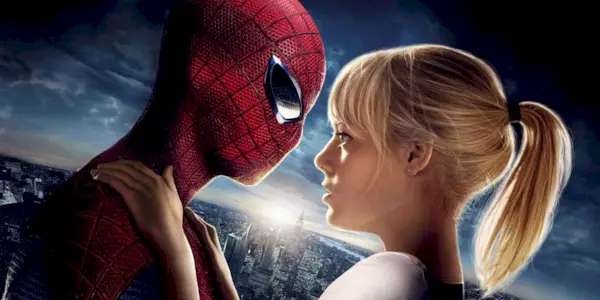 Spider-Man and Gwen Stacy embracing with a sunset in the background in The Amazing Spider-Man 2