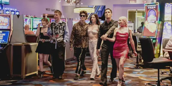 Ani (Mikey Madison), Ivan/Vanya (Mark Eydelshteyn) and their friends walking through the Vegas casino in Anora