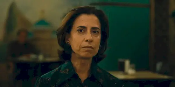 Fernanda Torres looking intently ahead in I