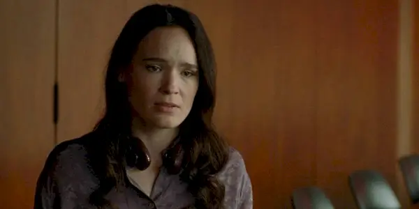 A woman looking emotional in I