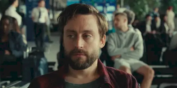 Kieran Culkin looking intently off-camera in A Real Pain