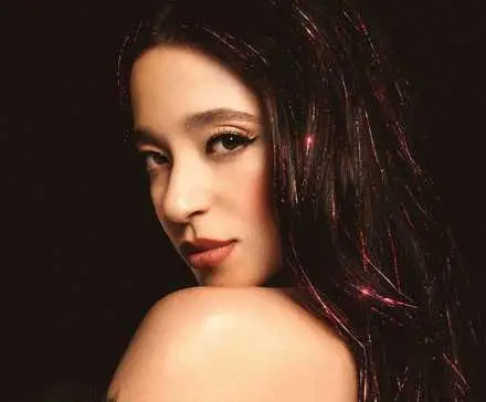 Mikey Madison as Anora on a movie poster.