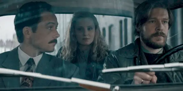 Taron Egerton, Nikita Efremov, and Sofya Lebedeva in a car in Tetris