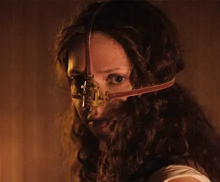Lea Myren with a nose mask on it in The Ugly Stepsister 