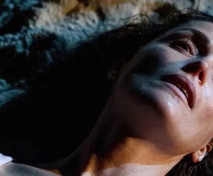 Close-up image of Linda (Rose Byrne) lying on the ground in If I Had Legs I