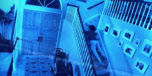 Kristi being dragged down the stairs in Paranormal Activity 2