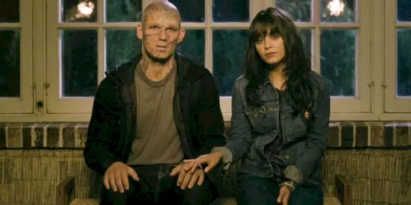 A screenshot of Vanessa Hudgens and Alex Pettyfer sitting side by side in Beastly (2011)