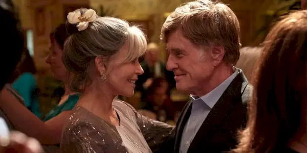 Jane Fonda and Robert Redford smiling and sharing a dance in Our Souls at Night