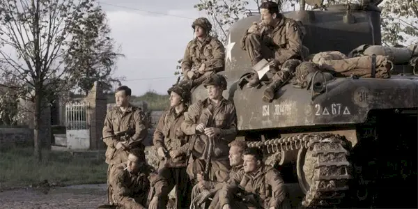 Easy Company around a tank in 