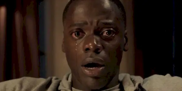 Daniel Kaluuya as Chris Washington crying and looking shocked in Get Out.