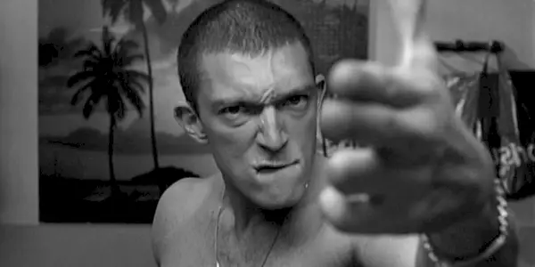 Vinz looking and pointing at the camera while biting his lip in 