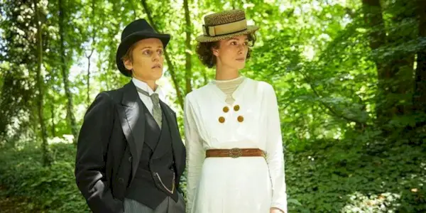 Colette and Missy in the woods looking in the same direction in Colette.