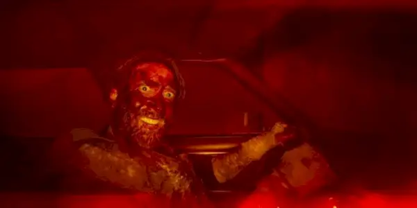 A wild-eyed Nicolas cage staring at the camera in Mandy