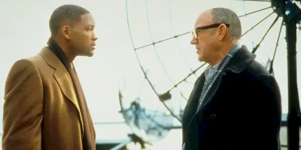  Will Smith and Gene Hackman talking next to satellite dishes in 