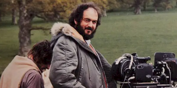 Stanley Kubrick smiling on the set of Barry Lyndon