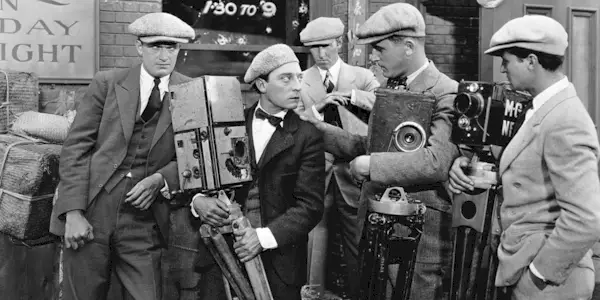 Buster Keaton and the Camera Operators Who Bully Him in The Cameraman