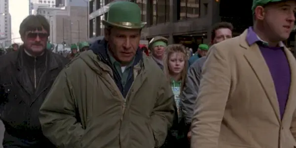 Harrison Ford as Richard Kimble, walking through Chicago on St. Patrick