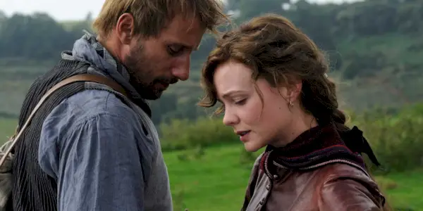 Matthias Schoenaerts and Carey Mulligan as Gabriel and Bathsheba meeting in an open field in Far From the Maddening Crowd.