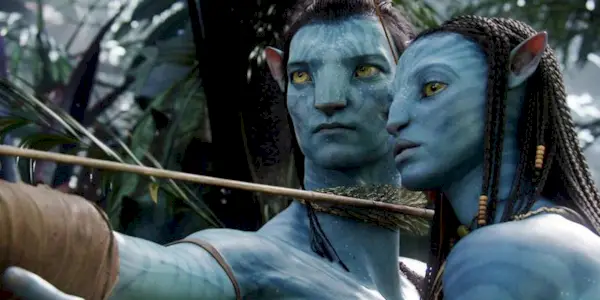 Jake Sully aims a bow and arrow while Neytiri looks on in Avatar