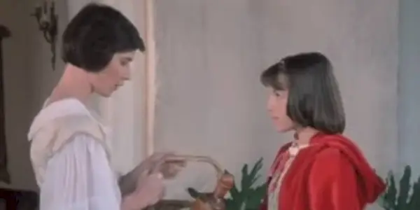 Red Riding Hood holding a basket in 