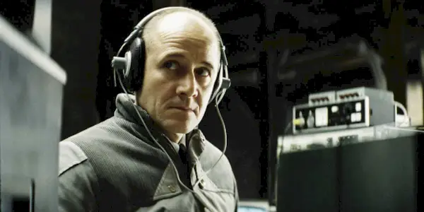 Ulrich Mühe with headphones on in 