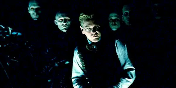 Saniel P. Schreber with a group of men in Dark City