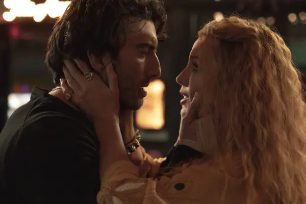 Justin Baldoni and Blake Lively in It Ends With Us. She is holding his face