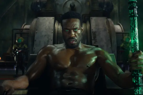 Yahya Abdul-Mateen II plays David Kane / Black Manta sits topless with glowing green eyes
