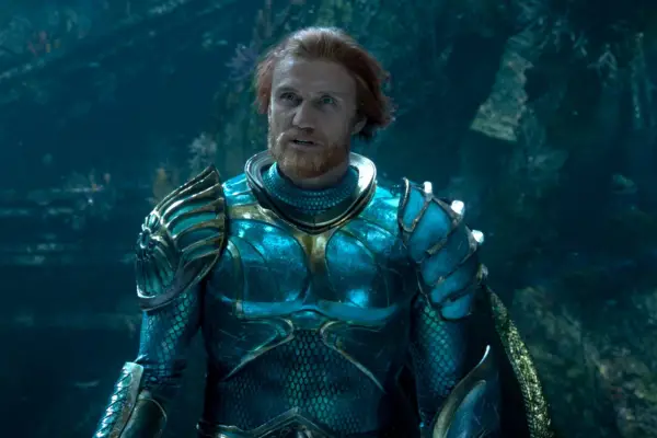 Dolph Lundgren plays Nereus wearing a blue and gold outfit