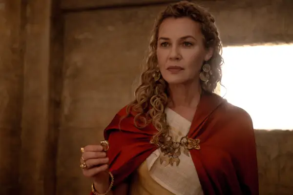 Connie Nielsen as Lucilla in red clock and light dress in Gladiator II from Paramount Pictures.