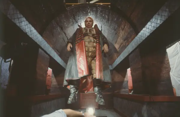 American actor Kenneth McMillan as Baron Harkonnen suspended in a hallway on the set of Dune directed and written by David Lynch.