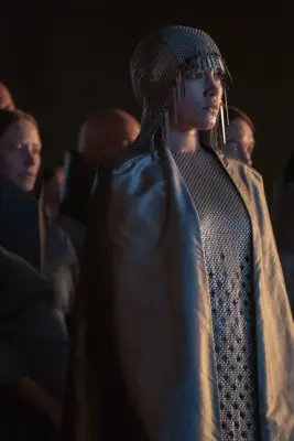 Florence Pugh as Princess Irulan Corrino in a chainmail cap and gown for Dune: Part Two.