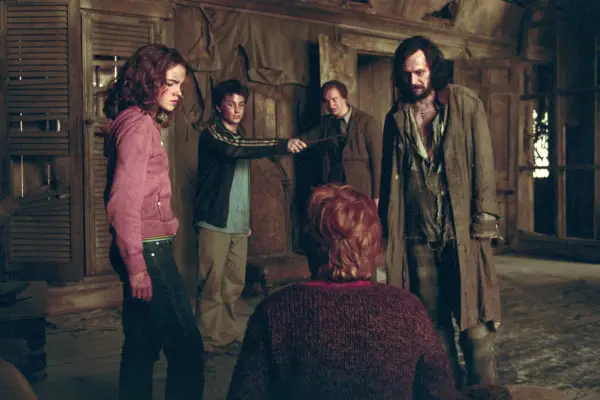 Emma Watson as Hermione Granger, Daniel Radcliffe as Harry Potter, David Thewlis as Remus Lupin and Gary Oldman as Sirius Black in Harry Potter and the Prisoner of Azkaban