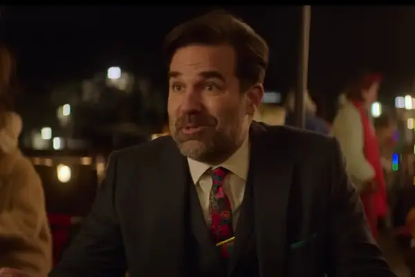 Rob Delaney plays Andrew Sullivan in Love at First Sight wearing a suit