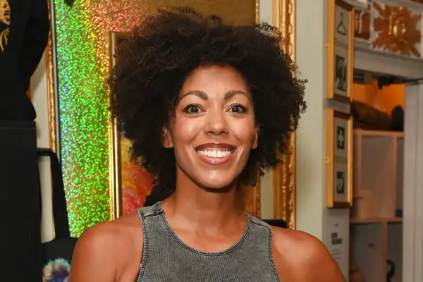Dr Zoe Williams photographed backstage at a theatre show, smiling for the camera
