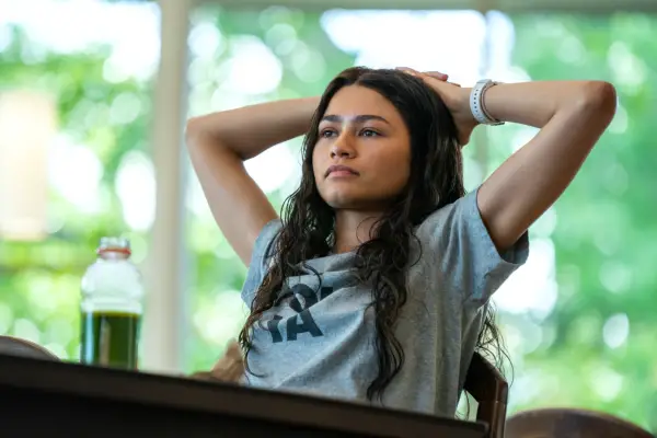 Zendaya leaning back in a t-shirt for the film Challengers.