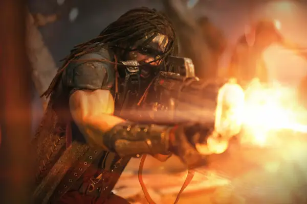 Darrian Bloodaxe fires an enormous gun in battle with an unseen foe