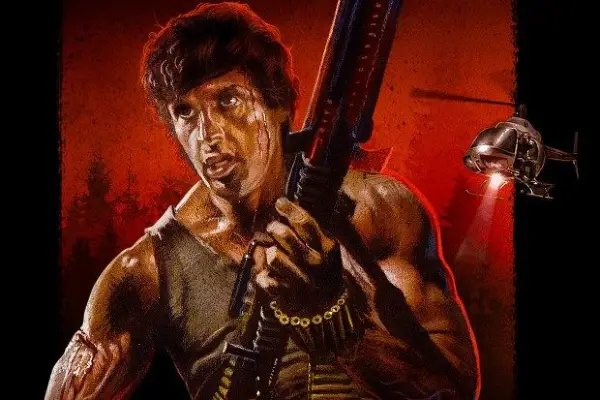 Rambo: First Blood key art showing Rambo with a large gun, with a helicopter in the background