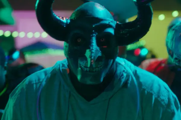 A person wearing a horned mask in The First Purge