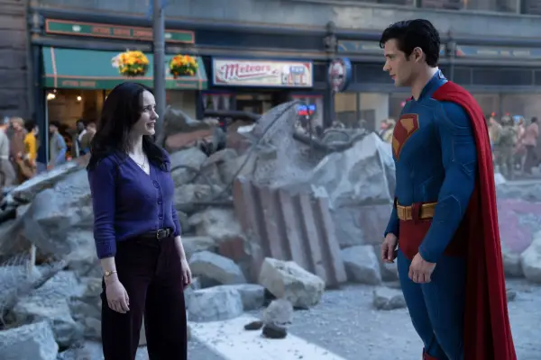 Rachel Brosnahan and David Corenswet play Lois Lane and Superman, standing across from one another amid some rubble