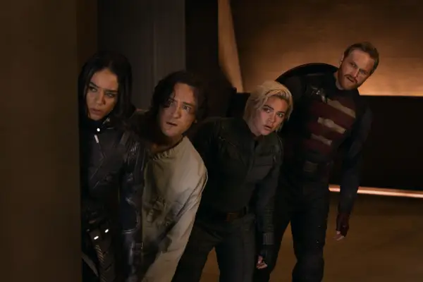 Ghost, Bob, Yelena and John Walker peer round a corner in a scene from Thunderbolts*