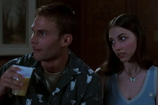 Sean William Scott as Stifler and Eden Riegel as Sarah in American Pie (1999) sitting together