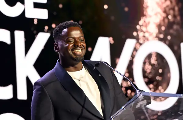 Daniel Kaluuya wearing a black suit jacket and white shirt