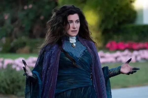 Kathryn Hahn as Agatha Harkness in WandaVision in witch attire with her arms outstretched