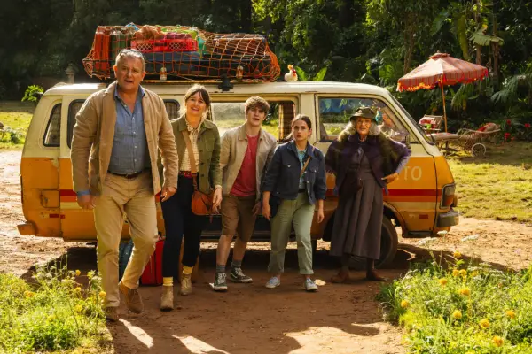 The cast of Paddington in Peru stood by a camper van