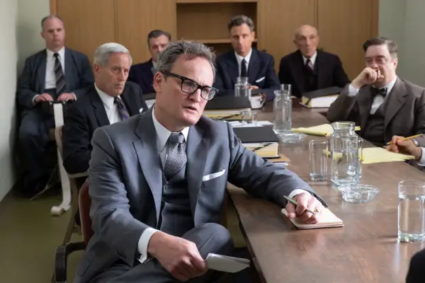 Jason Clarke as Roger Robb sitting in a meeting room