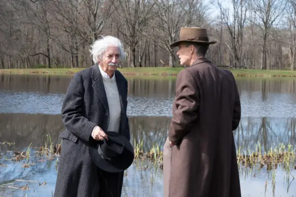 Tom Conti as Albert Einstein, standing by a lake