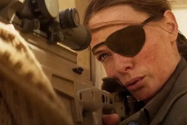 Rebecca Ferguson as Ilsa Faust in Mission Impossible 7, looking down the scope of a sniper rifle